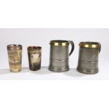 Two19th Century pewter and brass pint tankards, one with the base engraved Fox & Hounds Hotel,