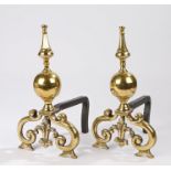 Pair of Regency brass and cast iron fire dogs, the point and orb finials above pierced scroll and