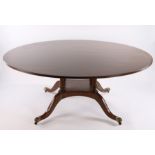 Victorian style mahogany dining table, the substantial circular top with banded border, raised on