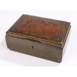 Secessionist brass and burr wood casket, the top with a panel and brass inset flower head and leaf