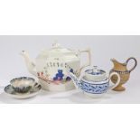 19th Century pottery teapot, with a swan to the handle above a fence and flower decorated body,