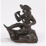 19th Century bronze, of a monkey playing an instrument seated on a rock, 8cm high