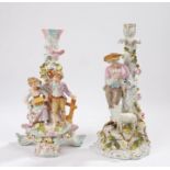Two 19th Century Sitzendorf porcelain candlesticks, the first with a man standing holding a dove and