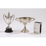 Two silver trophy cups, one with cover, white metal matchbox holder (3)