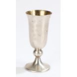 Russian silver cup, the fluted body with foliate decoration, on a bulbous stem and flared foot,