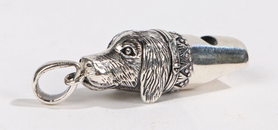 Silver whistle in the form of a Dog head