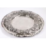 Substantial Portuguese silver charger, the crimped rim surrounding an embossed border decorated with