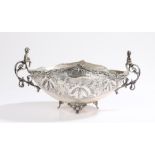 Russian silver basket, the cherub capped scroll handles flanking an oval body decorated with