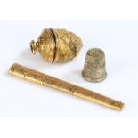 Victorian gilt metal thimble case and bodkin case, the thimble case with foliate and scroll