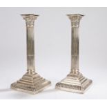 Pair of Edward VII silver Corinthian column candlesticks, London 1908, maker Goldsmiths &