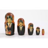 A set of five Beatles Russian Babushka Russian Dolls, which all fit into one another.M
