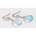 Pair of aquamarine and diamond earrings, the faceted teardrop form aquamarine drops above diamond