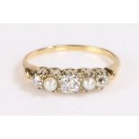 Diamond and pearl ring, set with three diamonds interspersed by two pearls, ring size K, 2.7g