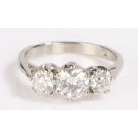 Platinum and diamond ring, the central 0.88ct diamond flanked by a further two diamonds, total