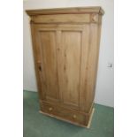 Pine wardrobe, with a door above a single drawer, 98cm wide