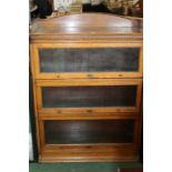 Globe Wernicke style oak sectional bookcase, the swept dentil pediment above two glazed sections