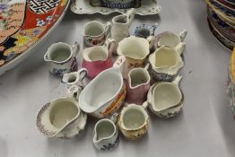 Collection of pottery and porcelain jugs and sauce boat
