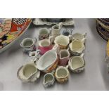 Collection of pottery and porcelain jugs and sauce boat