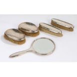 Four silver handled dressing table brushes, silver handled dressing table mirror (5)