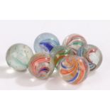 Collection of seven 19th Century glass marbles, to include Latticinio core swirls, size range 20mm