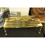 19th Century fire poker, trivet stand, a brush and a pair of brass tongs, (4)