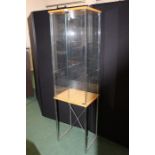 Floor standing display cabinet, raised on a cross frame support, 47cm x 171cm