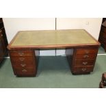 Oak kneehole desk, with an inset leather top and drawers to the kneehole, 168cm wide