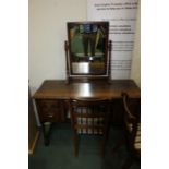 Oak dressing table, with mirror above an arrangement of five drawers, raised on turned legs and