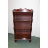 Regency style mahogany waterfall bookcase, 57cm wide