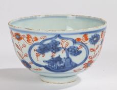 Japanese porcelain tea bowl, Edo period, with red and blue flowers to the body and buildings