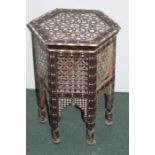 Middle Eastern occasional table, set with bone and mother of pearl and a panel and fret base