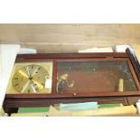 Acctim 31 day wall clock, the brass effect dial with Roman numerals, in original box