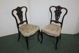 Pair of early 20th Century mahogany side chairs, with a carved foliate back, (2)