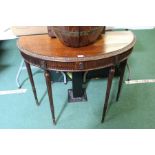 Mahogany demi-lune occasional table, with carved reeded frieze, on reeded legs 91cm wide