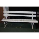 White painted garden bench, with slats to the back and seat