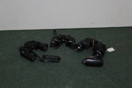 Three pairs of binoculars, to include Vickers, Carl Zeiss and Dollond, (3)