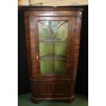 Walnut standing corner cupboard, with astragal glazed door above a panelled cupboard door, 89cm