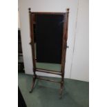 Regency style cheval mirror, the rectangular mirror with turned supports and arched legs terminating