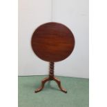 Victorian mahogany tilt top occasional table, the circular top raised on a bobbin turned stem,