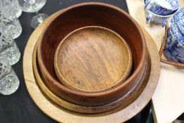 Four treen bowls, two shallow examples and two higher sided, (4)