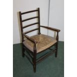 Beech child's chair with flattened splat back, rush seat, on turned legs and stretchers