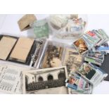 Album containing ten coloured and black and white postcards, black and white photograph of a