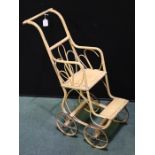 Wicker dolls pushchair with scrolled back and frame