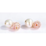 Pair of coral and pearl cufflinks, the coral carved as stylised flower heads