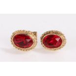 Pair of 9 carat gold and garnet set earrings, 0.7g