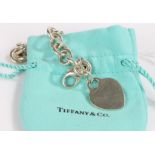 Tiffany & Co. silver bracelet, formed from circular links and with heart form pendant, housed in a