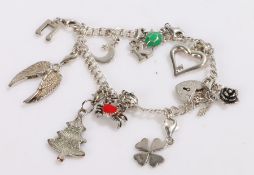 Silver charm bracelet with ten charms, 23.7g