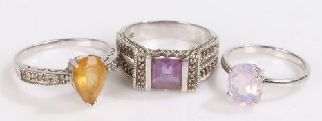 Three silver rings set with purple and yellow stones, 10.4g (3)
