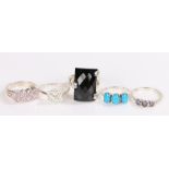 Five silver and coloured paste set rings, various sizes and styles, to include a turquoise set