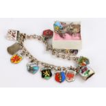 Silver charm bracelet set with eleven charms, three loose charms, 32.3g